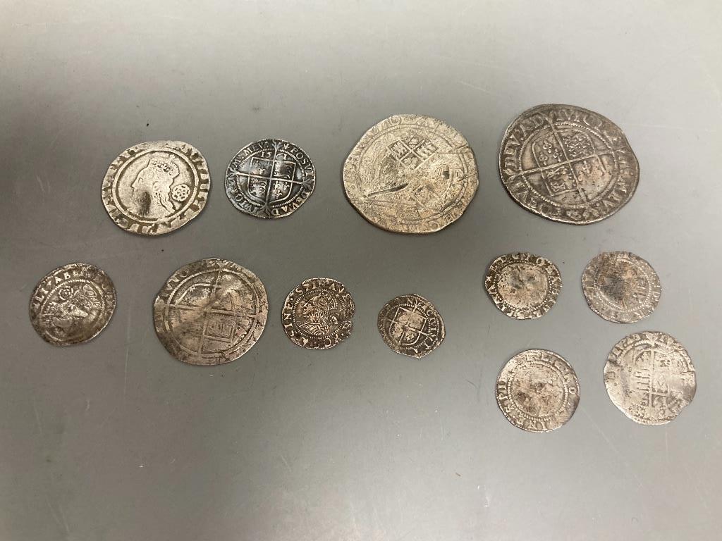 A group of Elizabeth I silver coins - two shillings, 1584 and 1575 sixpences, 1561 and 1569 threepences, 1561 halfgroat and four others worn